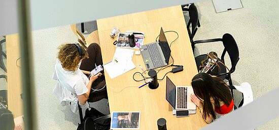 Students learning digitally on campus